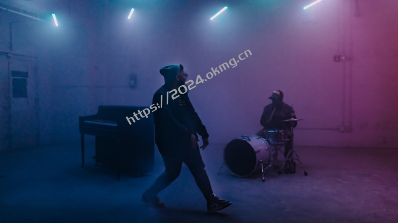 a man standing in front of a drum set